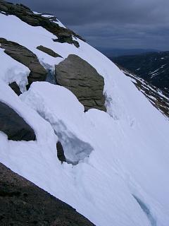 An impending avalanche on the cliffs above The Saddle.